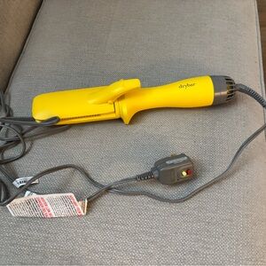 Drybar Vibrant Yellow Blow Dry Styling Iron in one.